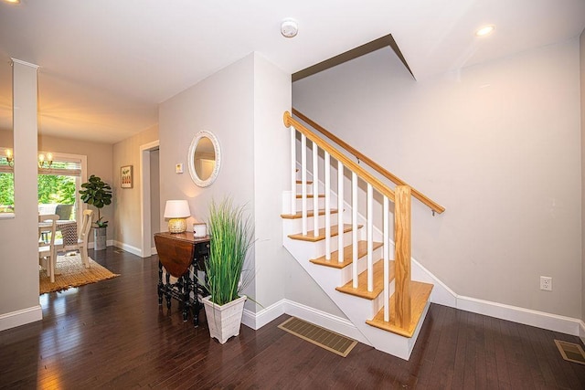 9 Marshall Rd, Kingston, NH 03848 - stairway with hardwood / wood-style floors and a chandelier