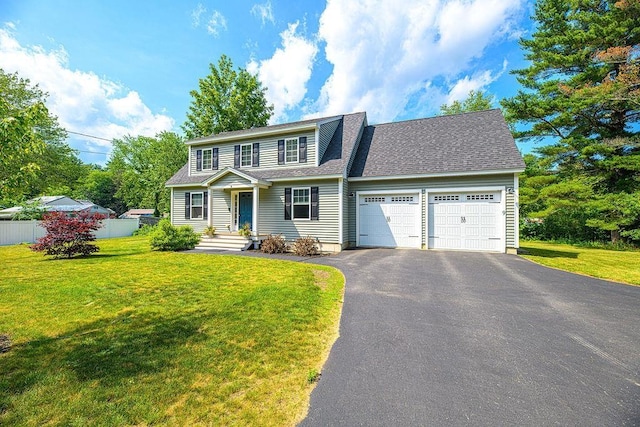 9 Marshall Rd, Kingston, NH 03848 - view of front of house with a garage, asphalt driveway, and a shingled roof