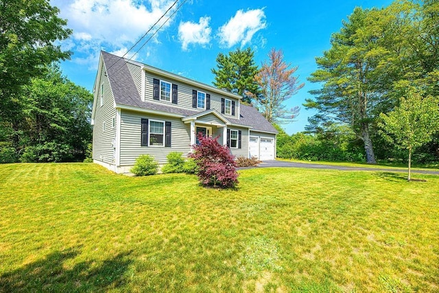 9 Marshall Rd, Kingston, NH 03848 - view of front of house with driveway, a front yard, an attached garage, and a shingled roof