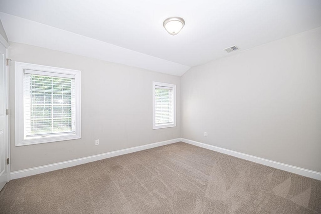 9 Marshall Rd, Kingston, NH 03848 - carpeted spare room with plenty of natural light and lofted ceiling