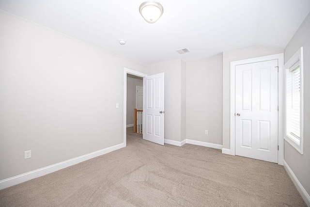 9 Marshall Rd, Kingston, NH 03848 - unfurnished bedroom featuring light colored carpet and vaulted ceiling