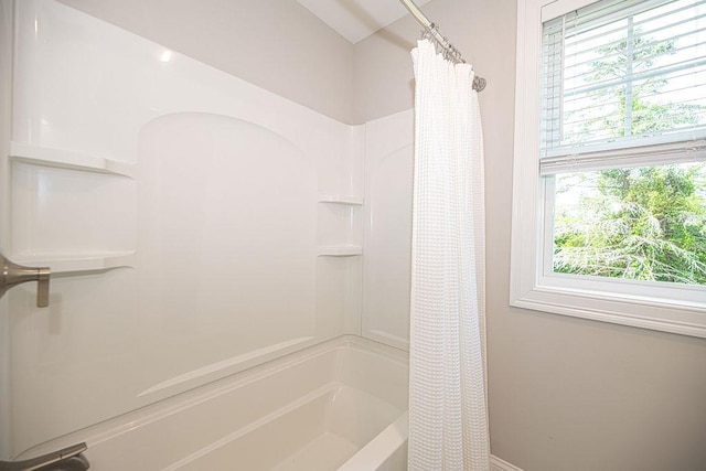 9 Marshall Rd, Kingston, NH 03848 - bathroom with healthy amount of natural light and shower / bath combo with shower curtain
