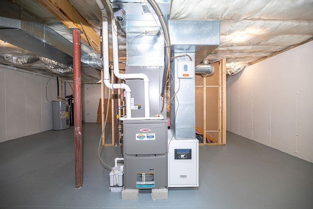 9 Marshall Rd, Kingston, NH 03848 - utility room with electric water heater and heating unit