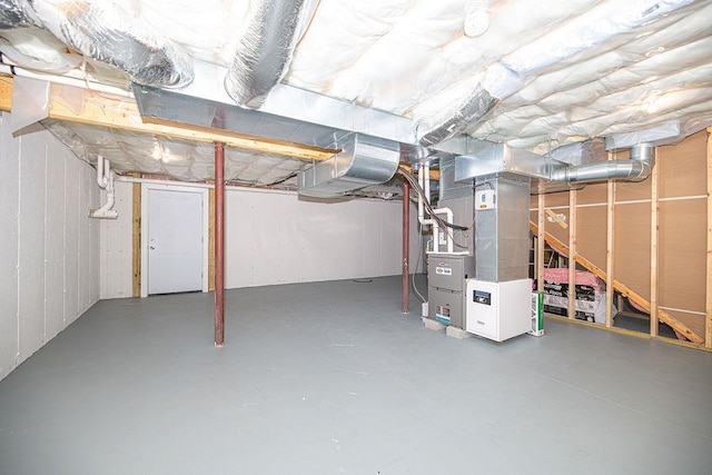 9 Marshall Rd, Kingston, NH 03848 - unfinished basement featuring heating unit