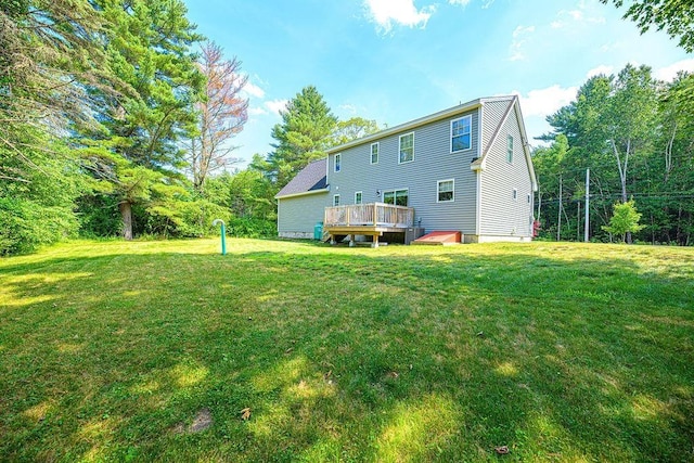 9 Marshall Rd, Kingston, NH 03848 - back of property featuring a lawn and a deck
