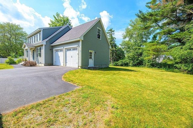 9 Marshall Rd, Kingston, NH 03848 - view of home's exterior with driveway, a garage, and a lawn
