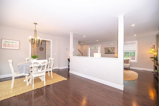 9 Marshall Rd, Kingston, NH 03848 - dining area featuring dark wood-style flooring, a chandelier, stairs, ornate columns, and recessed lighting