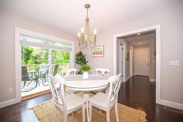 9 Marshall Rd, Kingston, NH 03848 - dining space featuring a chandelier and dark wood-type flooring