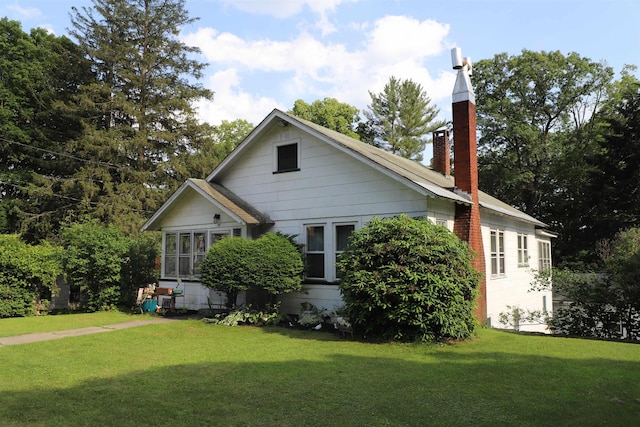 79 Wall St, Springfield, VT 05156 - view of side of home with a chimney and a yard