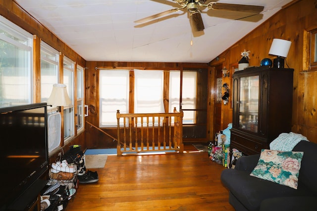 79 Wall St, Springfield, VT 05156 - living room with wood walls, hardwood / wood-style flooring, a ceiling fan, and vaulted ceiling