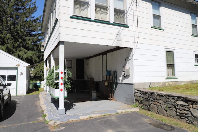 79 Wall St, Springfield, VT 05156 - view of home's exterior with a carport and an outdoor structure