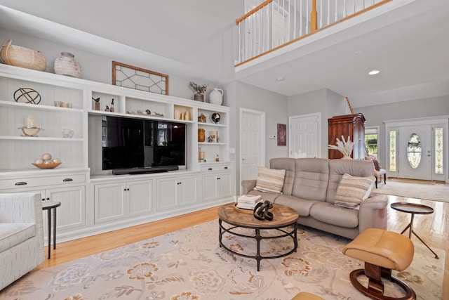 47 Misty Oak Dr, Concord, NH 03301 - living room featuring light wood finished floors and a high ceiling