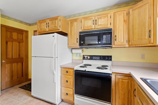 1A Rowland St, Somersworth, NH 03878 - kitchen featuring white appliances, light countertops, and light brown cabinetry
