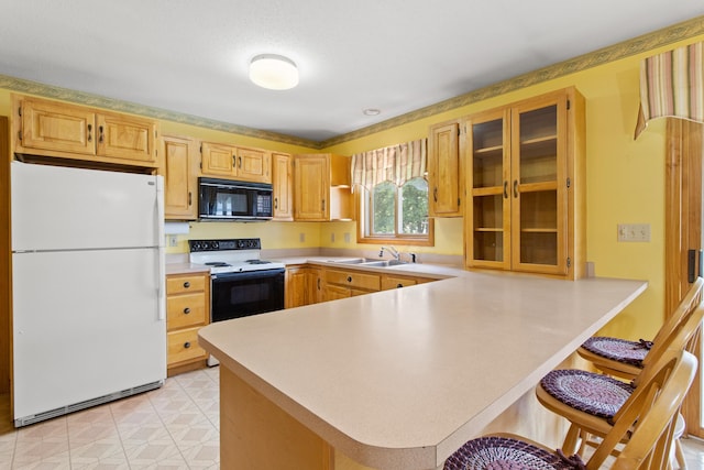 1A Rowland St, Somersworth, NH 03878 - kitchen featuring freestanding refrigerator, range with electric stovetop, black microwave, light countertops, and glass insert cabinets