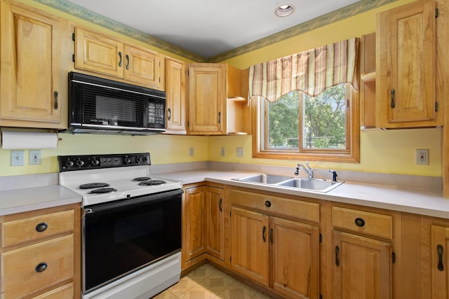 1A Rowland St, Somersworth, NH 03878 - kitchen with white range with electric cooktop, black microwave, light countertops, and light tile patterned flooring
