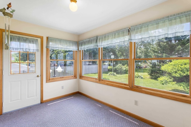 1A Rowland St, Somersworth, NH 03878 - unfurnished sunroom with carpet flooring and baseboards