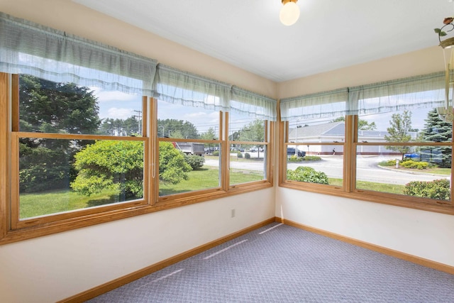 1A Rowland St, Somersworth, NH 03878 - unfurnished sunroom with carpet flooring and baseboards