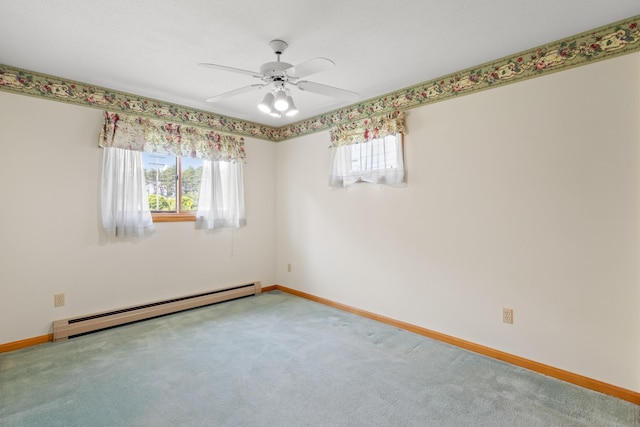 1A Rowland St, Somersworth, NH 03878 - carpeted empty room featuring a baseboard heating unit, healthy amount of natural light, and a ceiling fan