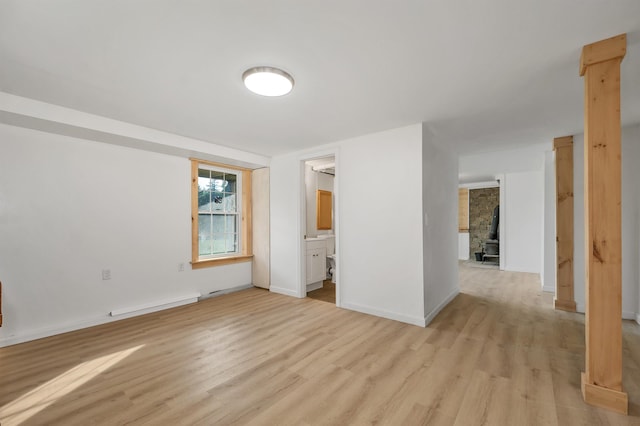 145 Bow Lake Rd, Barnstead, NH 03218 - empty room featuring a baseboard heating unit and light wood finished floors