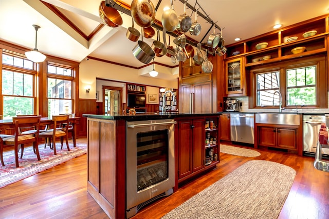 109 Reserve Pl, Concord, NH 03301 - kitchen with beverage cooler, stainless steel dishwasher, plenty of natural light, open shelves, and wainscoting