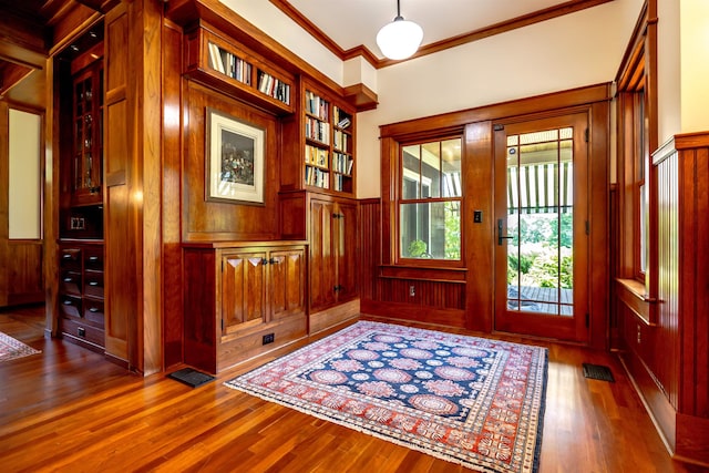 109 Reserve Pl, Concord, NH 03301 - doorway featuring wood finished floors, plenty of natural light, wainscoting, and crown molding