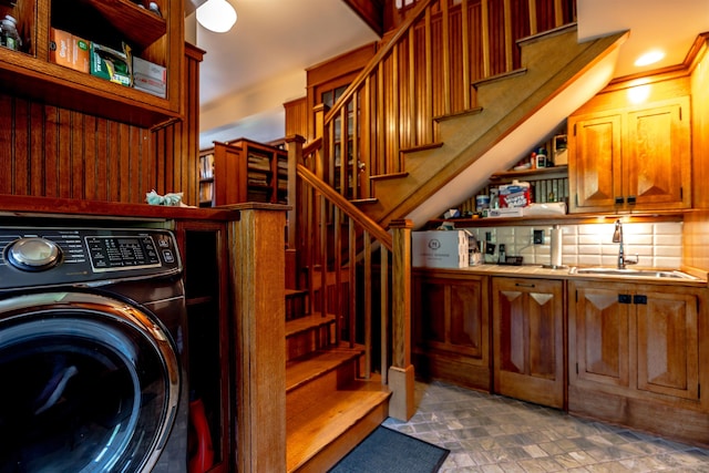 109 Reserve Pl, Concord, NH 03301 - laundry room with washer / dryer, stone finish floors, and cabinet space