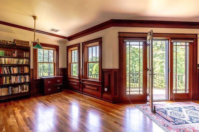 109 Reserve Pl, Concord, NH 03301 - entryway featuring healthy amount of natural light, a wainscoted wall, and wood finished floors