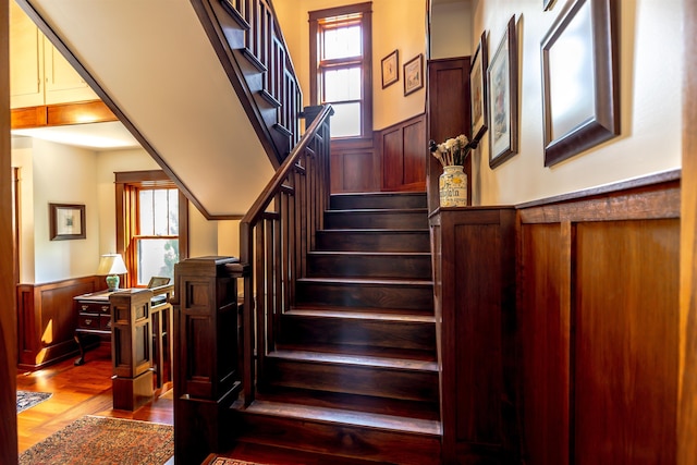 109 Reserve Pl, Concord, NH 03301 - staircase featuring a wainscoted wall and wood finished floors
