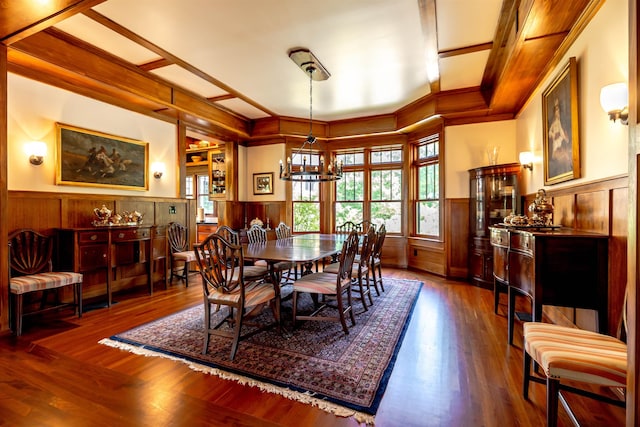 109 Reserve Pl, Concord, NH 03301 - dining area with a wainscoted wall, dark wood-style floors, ornamental molding, a chandelier, and a decorative wall