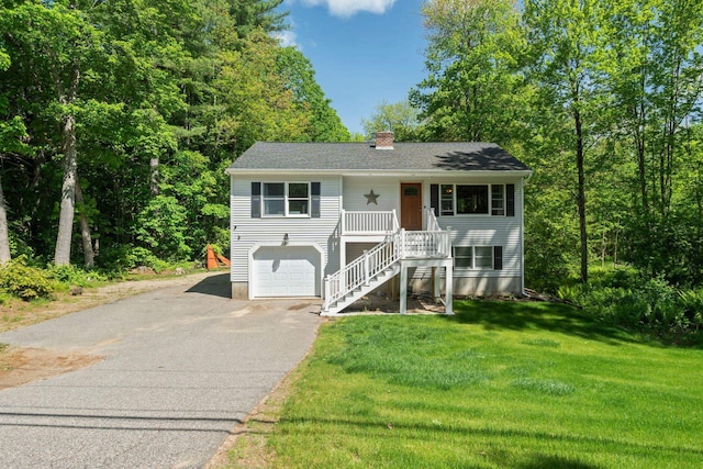 115 Blackwater Rd, Somersworth, NH 03878 - view of front of home featuring asphalt driveway, stairway, a chimney, covered porch, and a front lawn