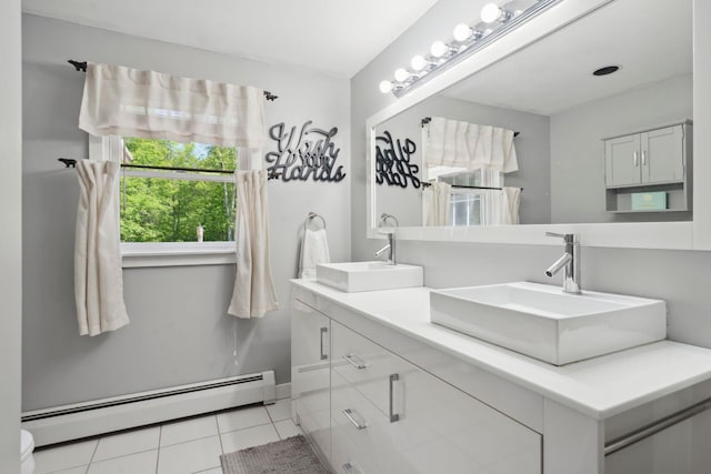 115 Blackwater Rd, Somersworth, NH 03878 - full bath featuring a baseboard heating unit, double vanity, and tile patterned floors