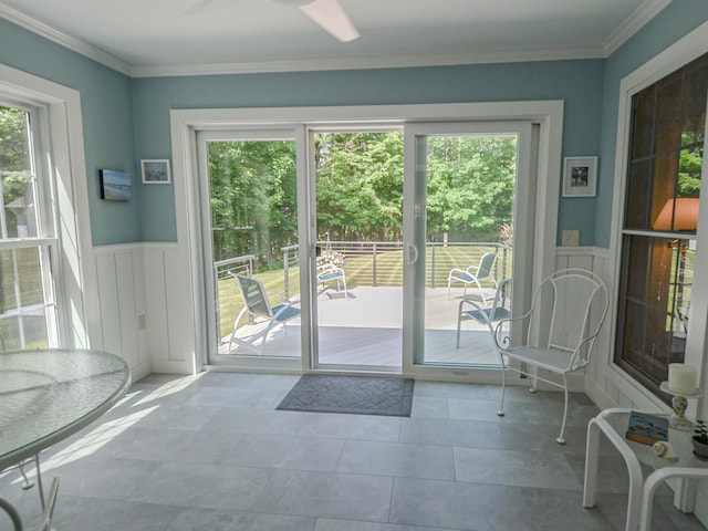 138 Page Rd, New London, NH 03257 - doorway to outside featuring healthy amount of natural light, wainscoting, crown molding, a decorative wall, and tile patterned floors