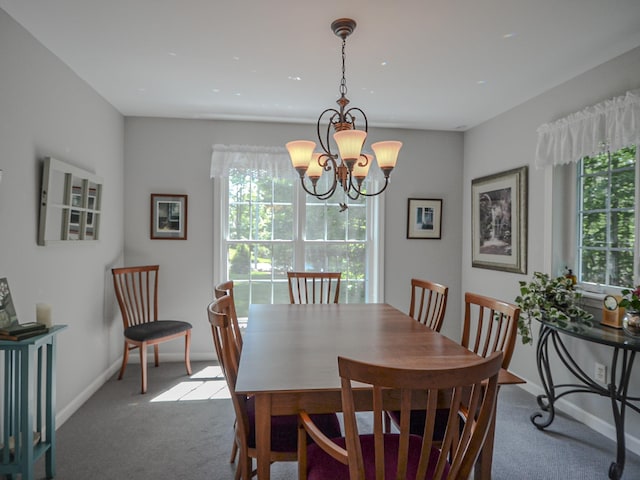 138 Page Rd, New London, NH 03257 - carpeted dining area featuring a chandelier and baseboards