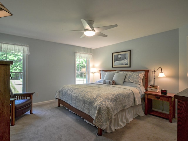 138 Page Rd, New London, NH 03257 - bedroom with multiple windows, carpet, and a ceiling fan