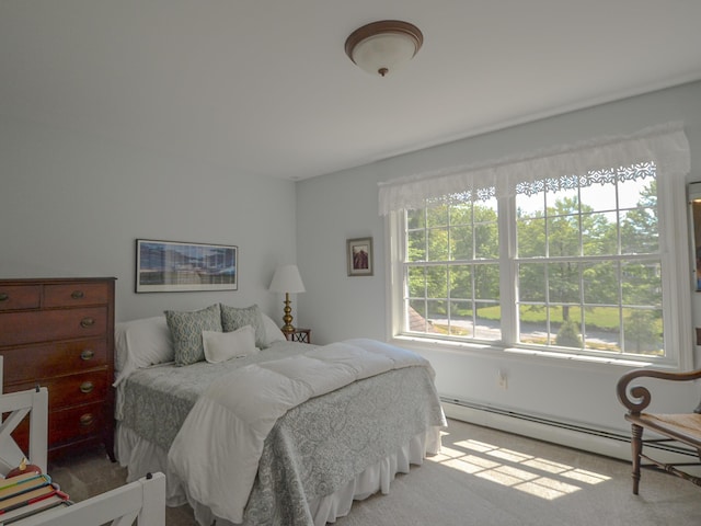 138 Page Rd, New London, NH 03257 - bedroom with carpet floors and a baseboard heating unit