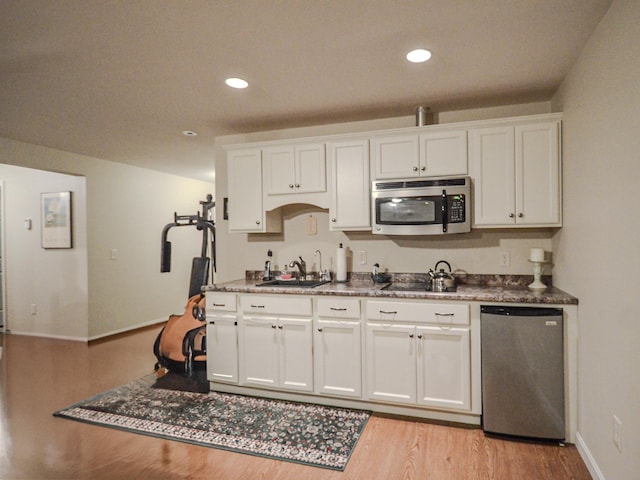138 Page Rd, New London, NH 03257 - kitchen featuring stainless steel microwave, dishwashing machine, white cabinetry, light wood finished floors, and recessed lighting