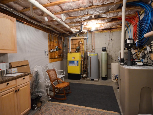 138 Page Rd, New London, NH 03257 - unfinished below grade area featuring water heater, a heating unit, and a water softener system