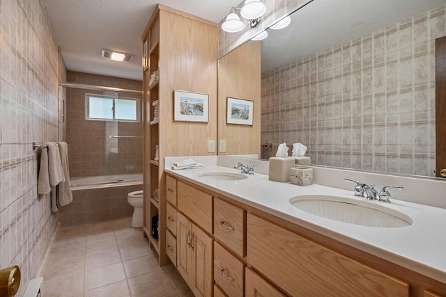 98 Marys Rd, Sunapee, NH 03782 - full bath featuring tile patterned floors, tiled shower / bath combo, double vanity, and a baseboard radiator