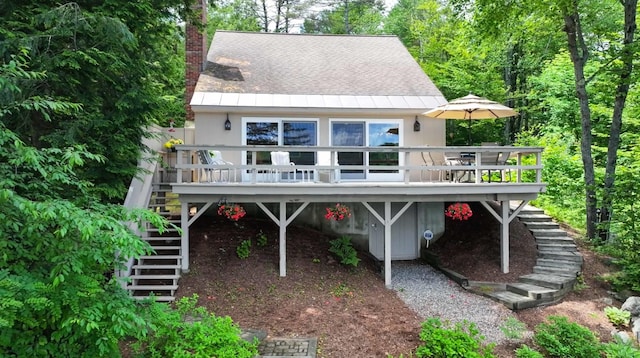 98 Marys Rd, Sunapee, NH 03782 - rear view of house featuring stairs, a wooden deck, and a chimney