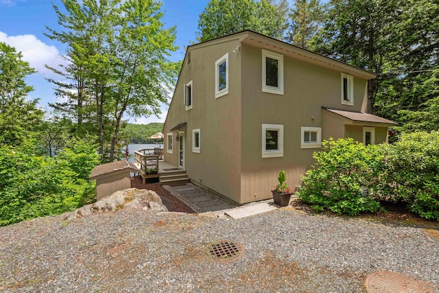 98 Marys Rd, Sunapee, NH 03782 - view of home's exterior featuring a wooden deck and stucco siding