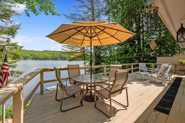 98 Marys Rd, Sunapee, NH 03782 - wooden deck with a water view, outdoor dining area, and a wooded view
