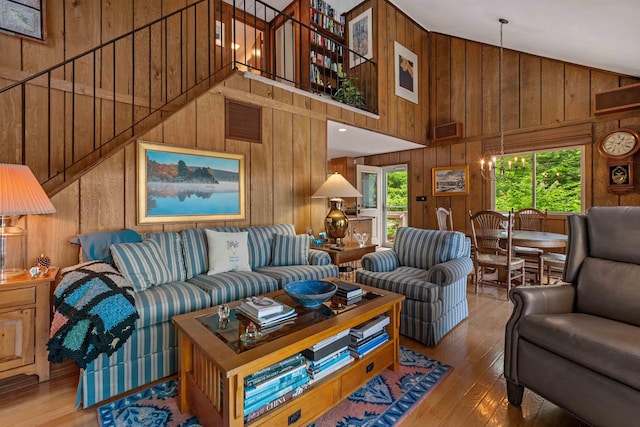 98 Marys Rd, Sunapee, NH 03782 - living room with wooden walls, wood-type flooring, and high vaulted ceiling