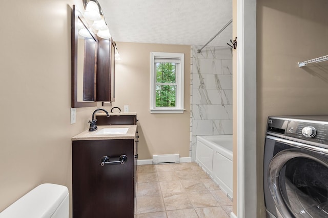 56 Durham Rd Unit 62, Dover, NH 03820 - bathroom with washer / clothes dryer, vanity, shower / washtub combination, and a textured ceiling