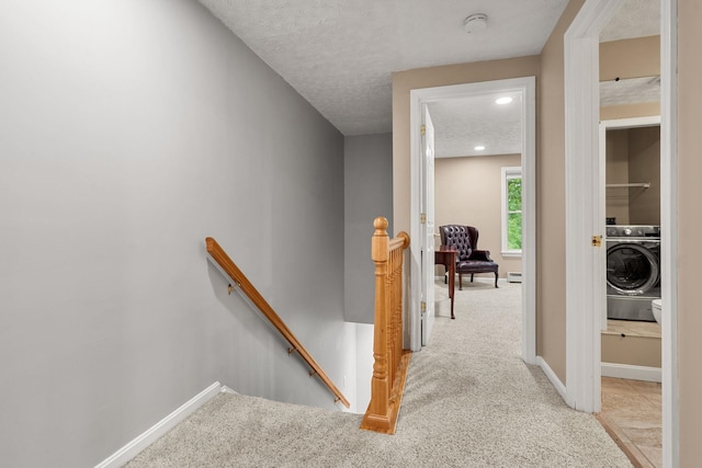 56 Durham Rd Unit 62, Dover, NH 03820 - hallway featuring an upstairs landing, washer / clothes dryer, carpet floors, a textured ceiling, and recessed lighting