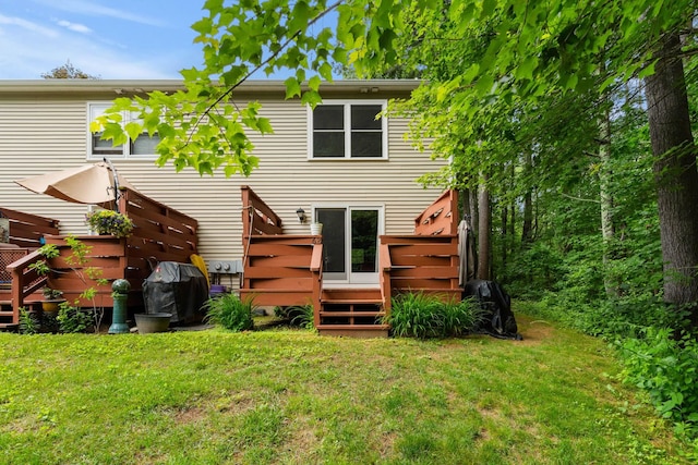 56 Durham Rd Unit 62, Dover, NH 03820 - back of house with a wooden deck and a yard
