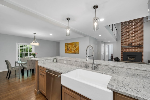 292 Forest Rd, Wolfeboro, NH 03894 - kitchen featuring stainless steel dishwasher, brown cabinets, dark wood-type flooring, hanging light fixtures, and recessed lighting