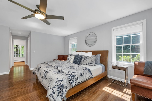 292 Forest Rd, Wolfeboro, NH 03894 - bedroom featuring multiple windows, wood finished floors, a ceiling fan, baseboard heating, and recessed lighting