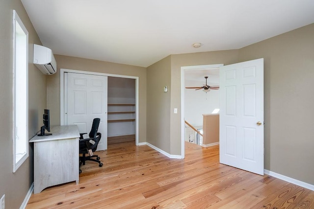 27 Wentworth Ter, Dover, NH 03820 - office area featuring a wall unit AC and light wood-style flooring