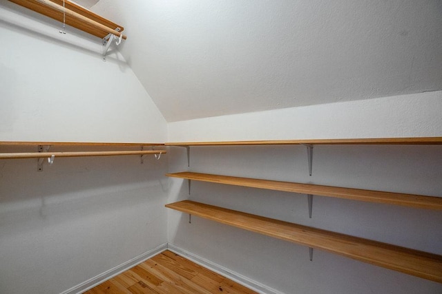 27 Wentworth Ter, Dover, NH 03820 - walk in closet featuring light wood finished floors and lofted ceiling