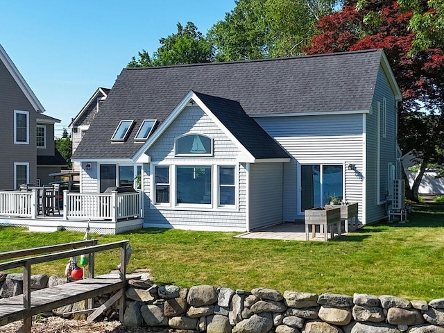 27 Wentworth Ter, Dover, NH 03820 - back of house featuring a deck, a lawn, a patio area, and roof with shingles